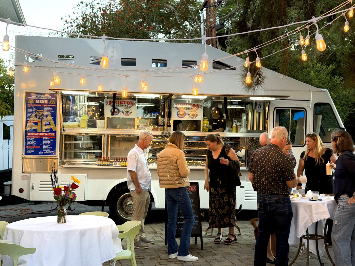 Prieto's food truck serving guests at an evening event