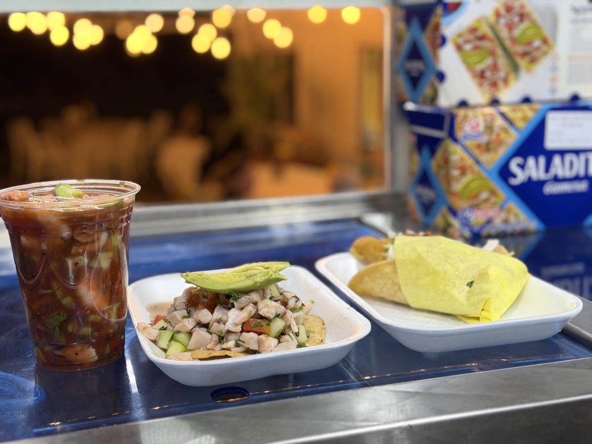 Seafood cocktail, ceviche tostada and tacos at an event